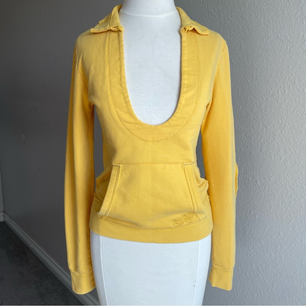 Y2K yellow Rip Curl surf sweater with a plunging neckline